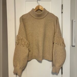 Elegant Tan Turtleneck Sweater with Fringe